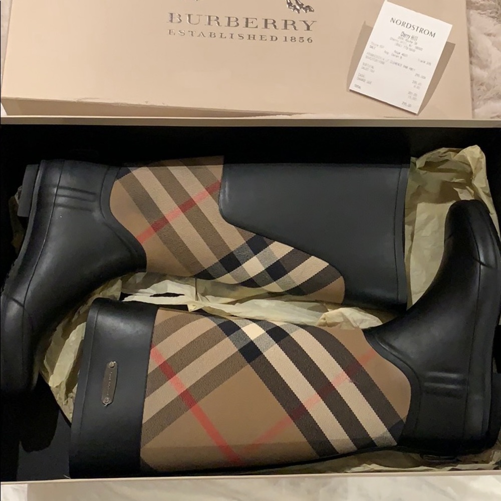 BURBERRY rain boots.
